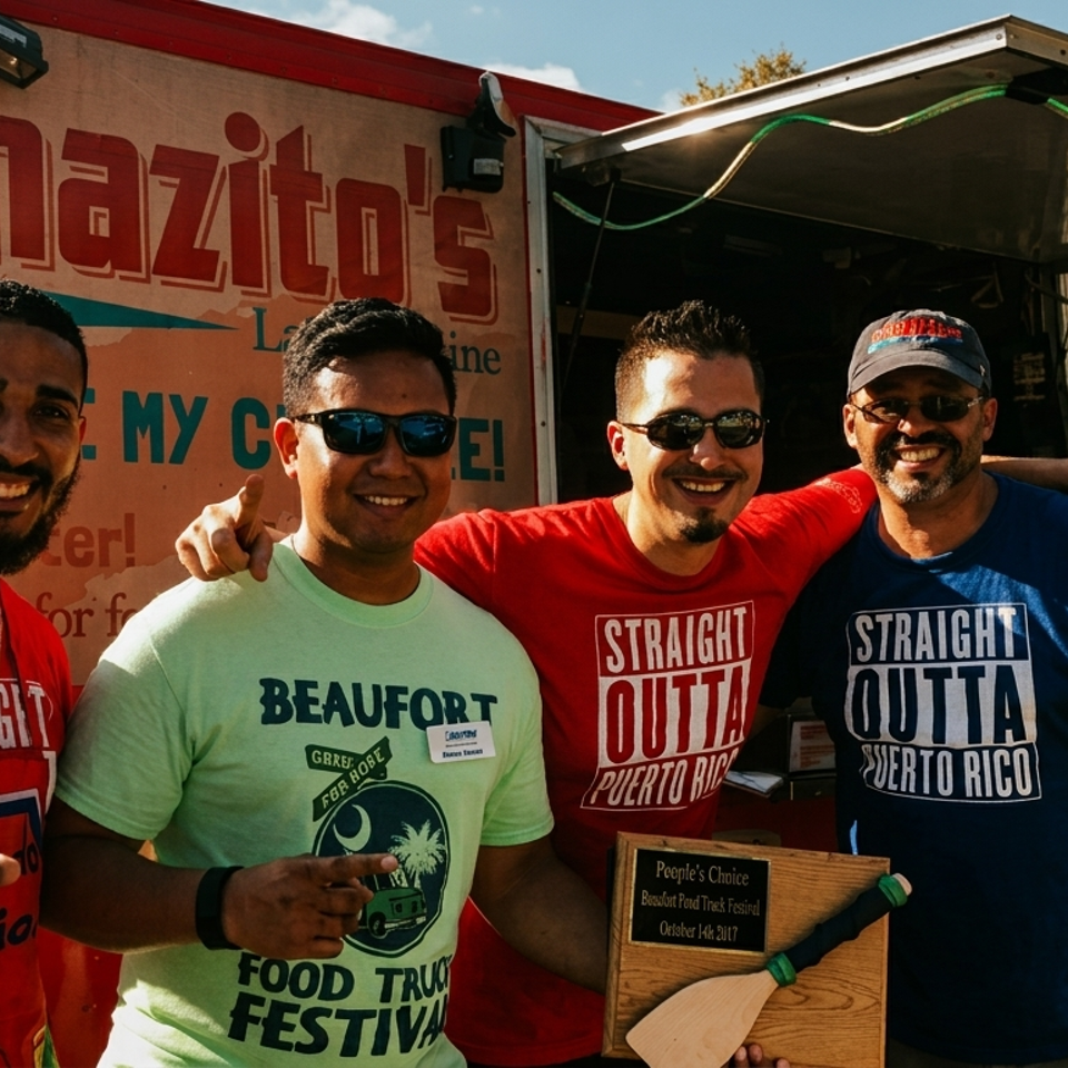 Four smiling men pose in front of a Latino food truck, with one holding a People's Choice award and a woman standing nearby.